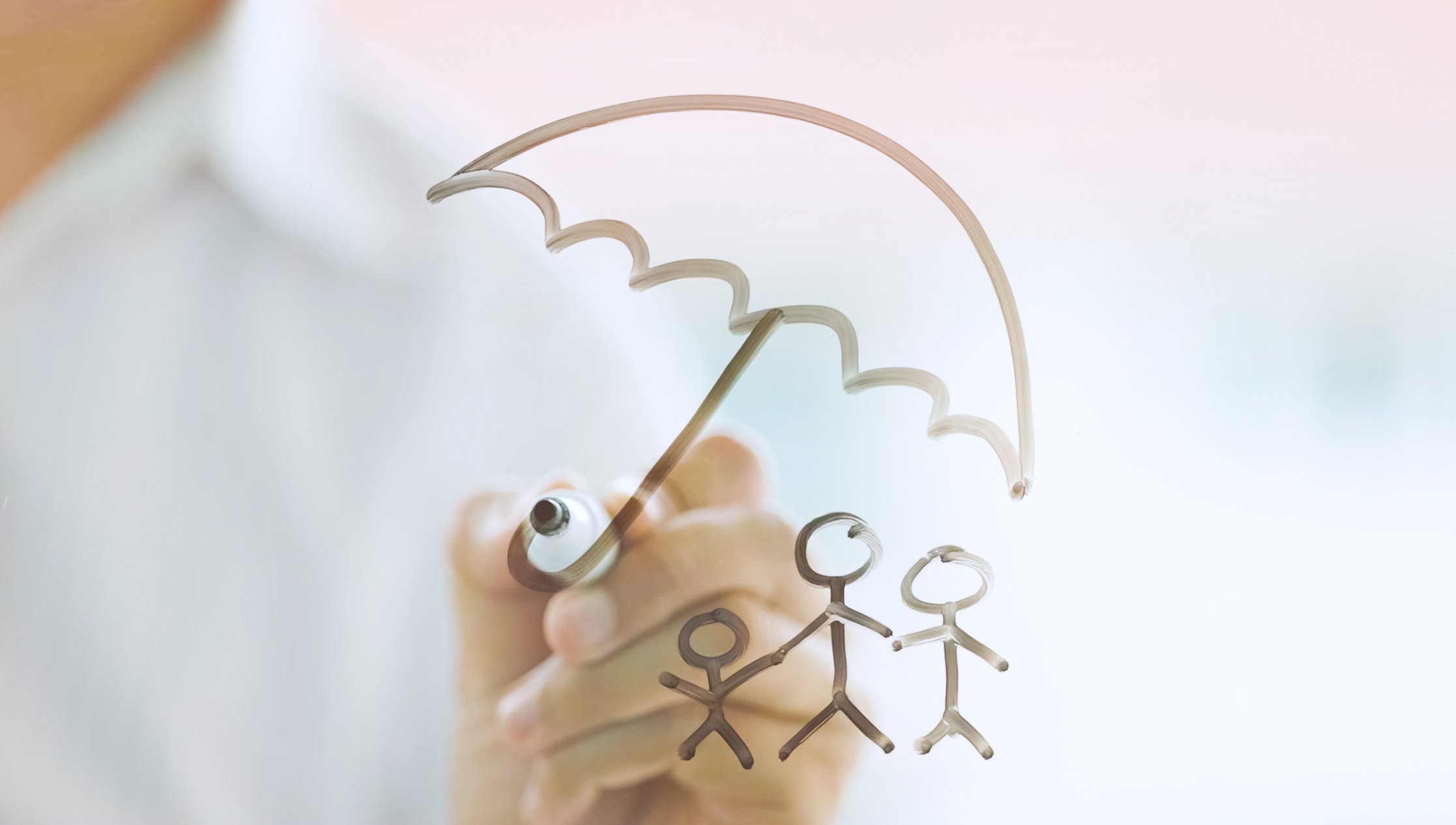 Businessman drawing Family protection insurance concept